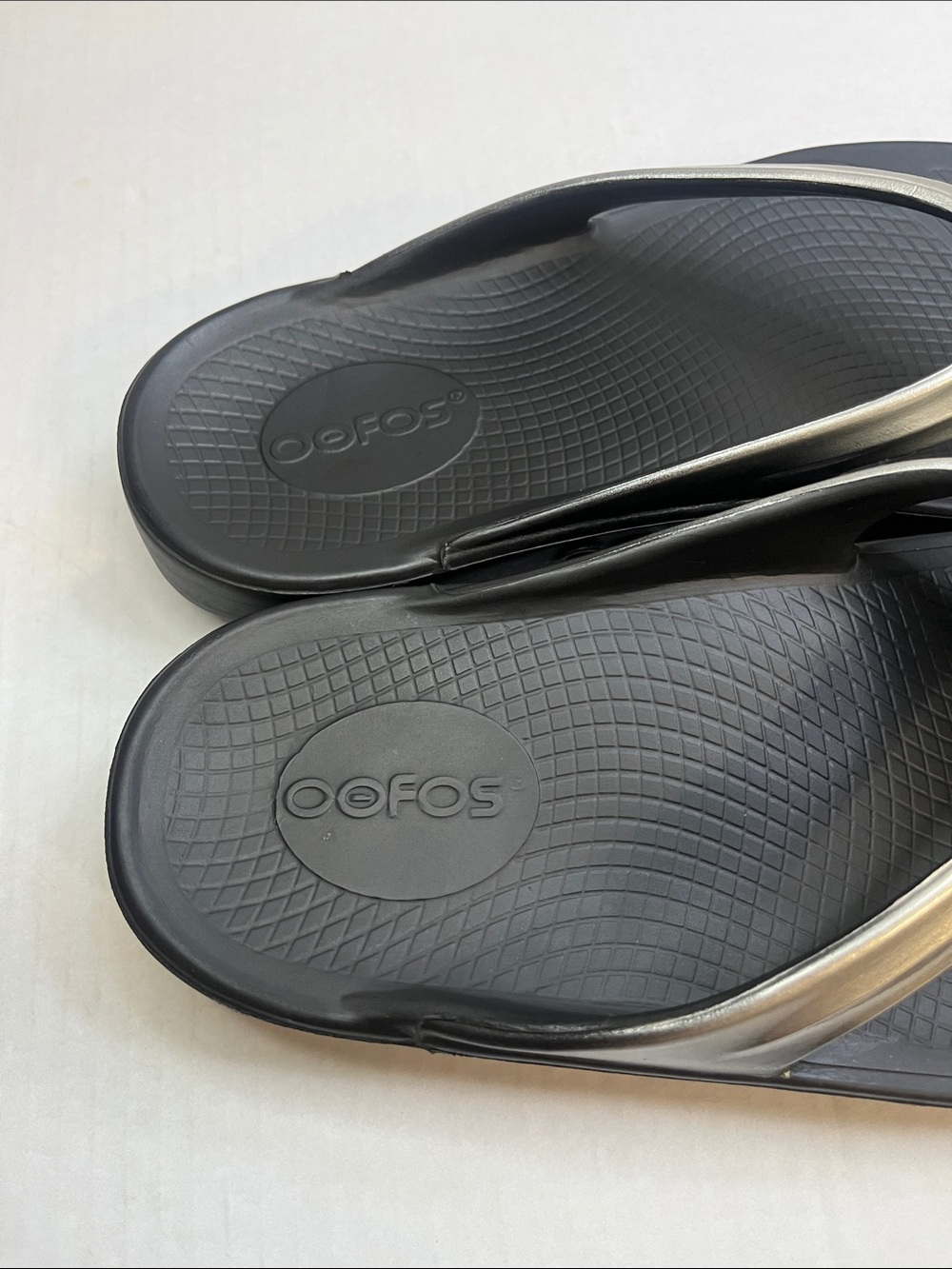 OOFOS Women's Black Flip Flop Sandals with Metallic Silver Straps - Picture 3 of 12